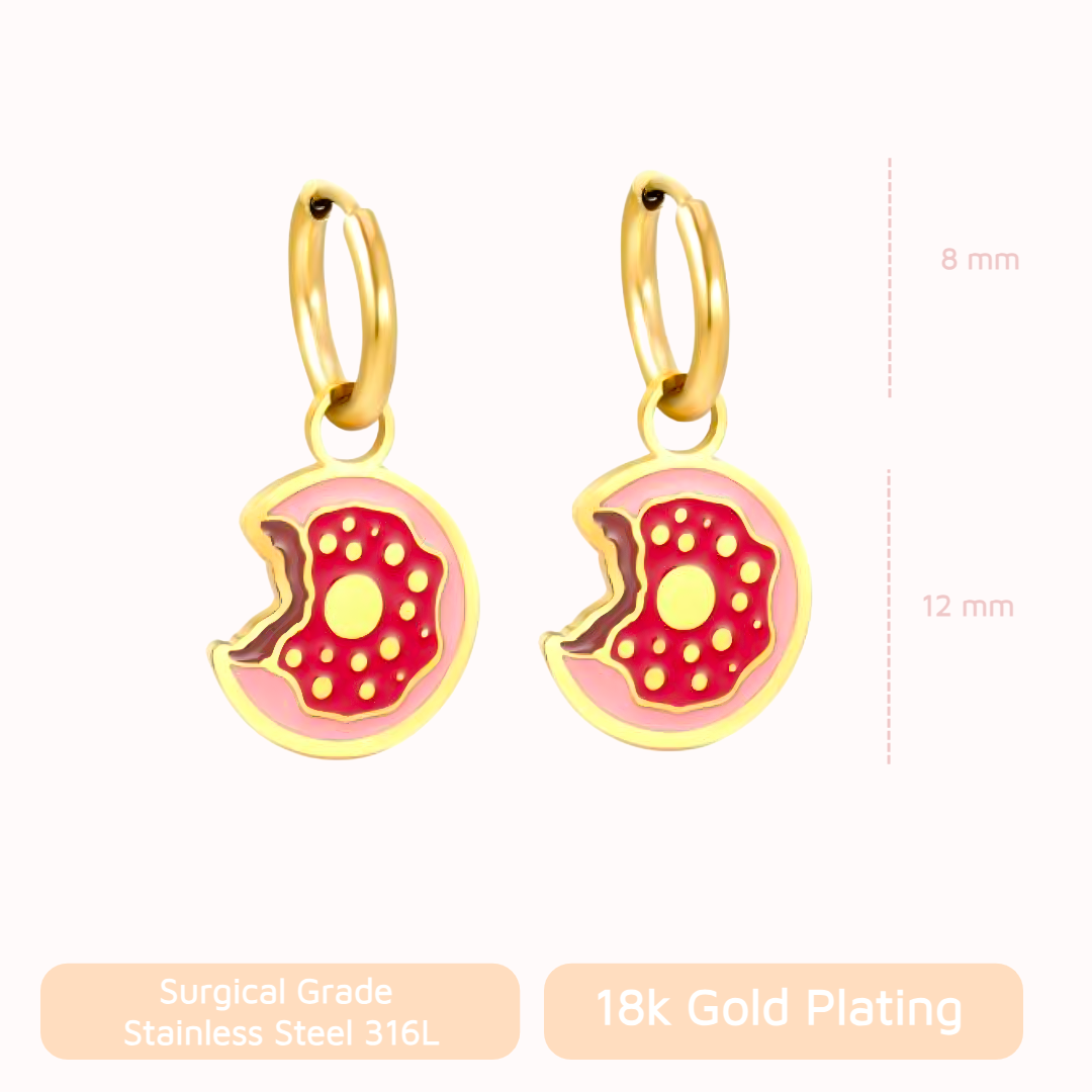 Donut-shaped earrings with gold plating on a white background
