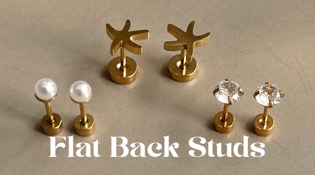 Set of flat back studs with gold posts on a beige background