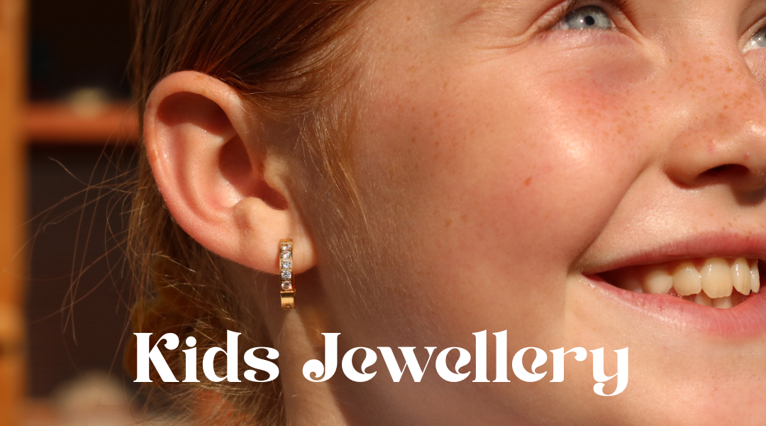 Close-up of a child wearing a small gold earring with 'Kids Jewellery' text overlay.