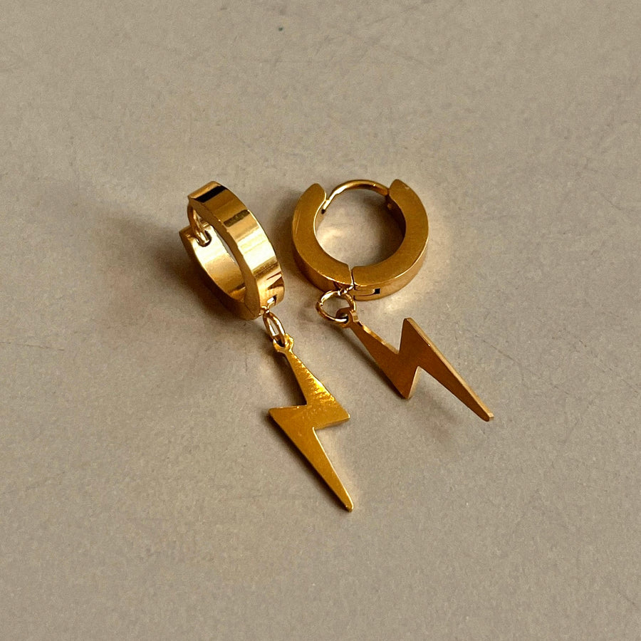 Lightning Bolt Huggies: gold huggie hoops with a lightning bolt charm