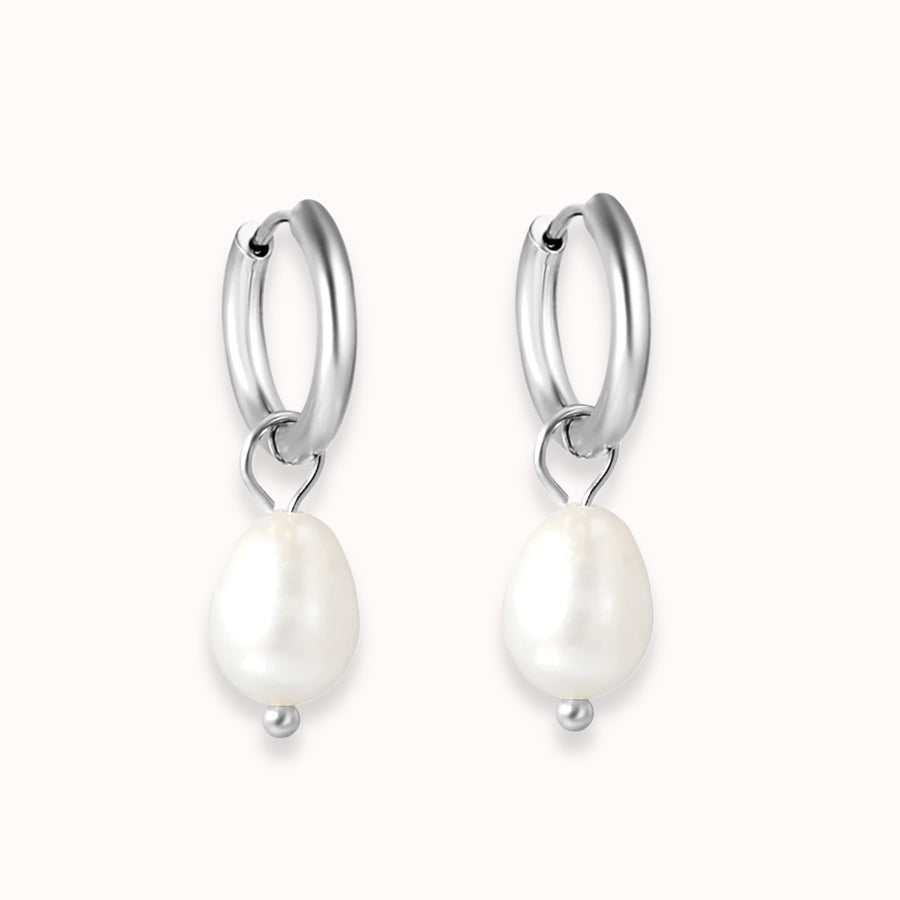Luna Pearl Drop Huggies in silver: huggie hoops with a pearl drop