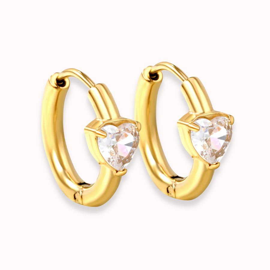 Sweetheart Spark Huggies in gold: huggie hoops with a heart-shaped crystal