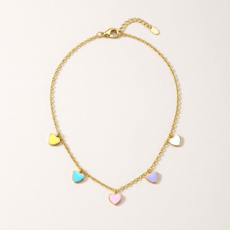 Candy Hearts Necklace: hypoallergenic kids' necklace, laid flat on a soft stone background