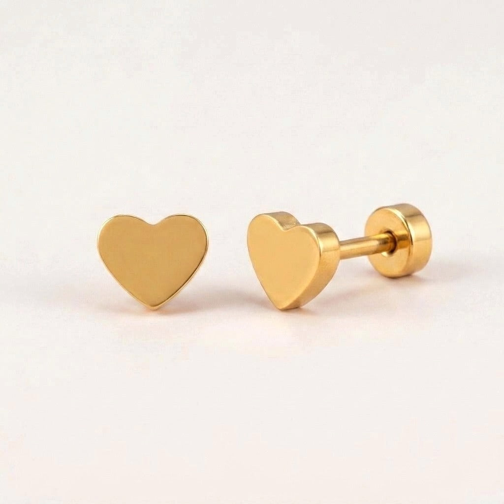 Classic Heart Flat Backs Gold: hypoallergenic kids' flat back stud earrings, shown front and side on a soft stone background
