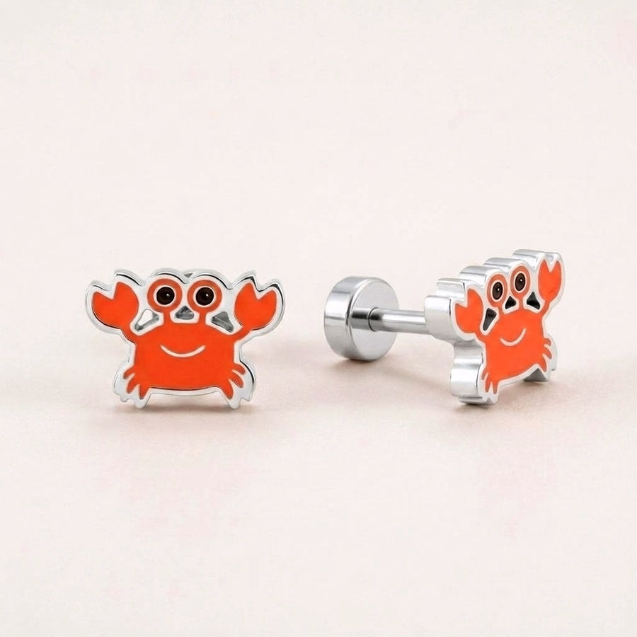 Crabby Flat Back Studs Silver: hypoallergenic kids' flat back stud earrings, shown front and side on a soft stone background