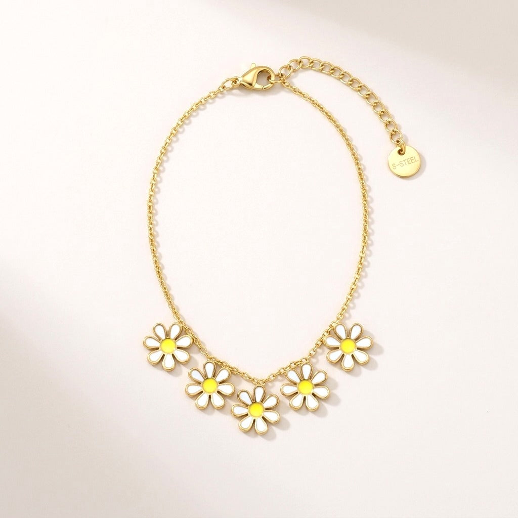 Daisy Chain Necklace: hypoallergenic kids' necklace, laid flat on a soft stone background