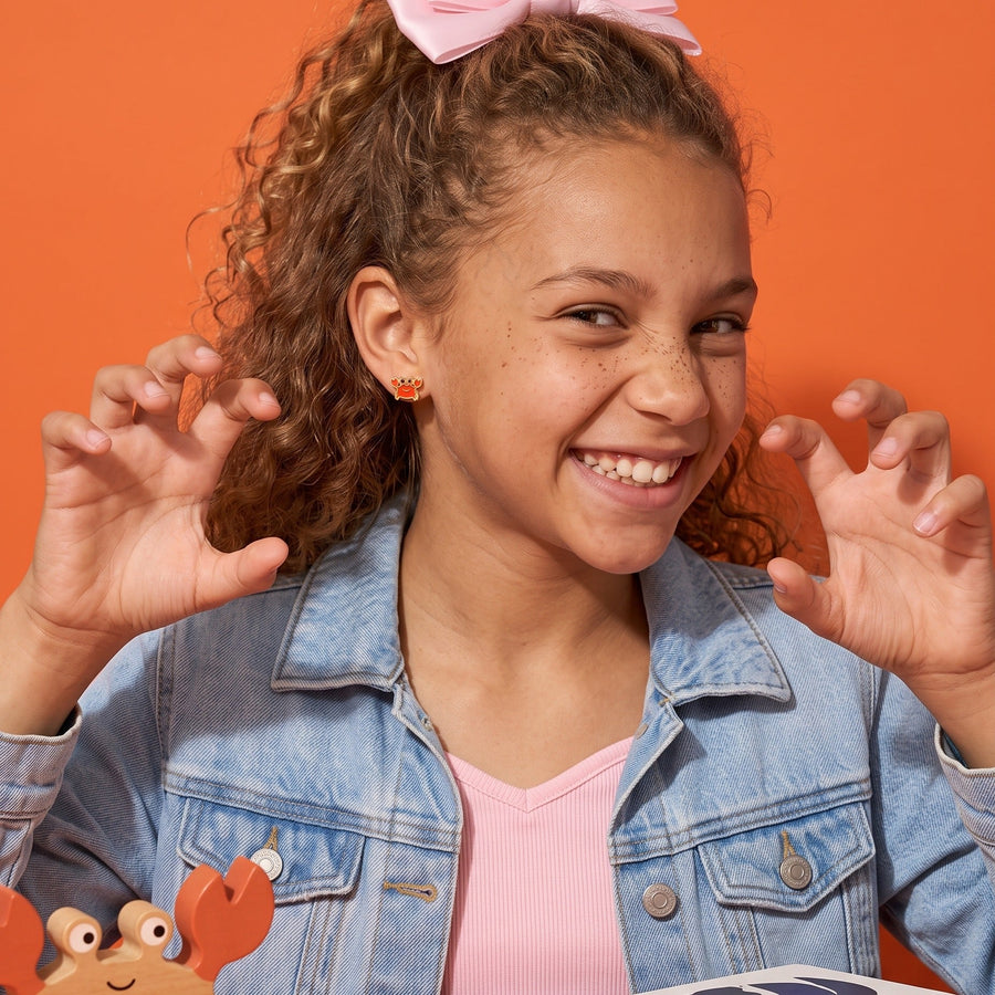Crabby Flat Back Studs Gold worn by a smiling girl, animal lover look: hypoallergenic kids' earrings