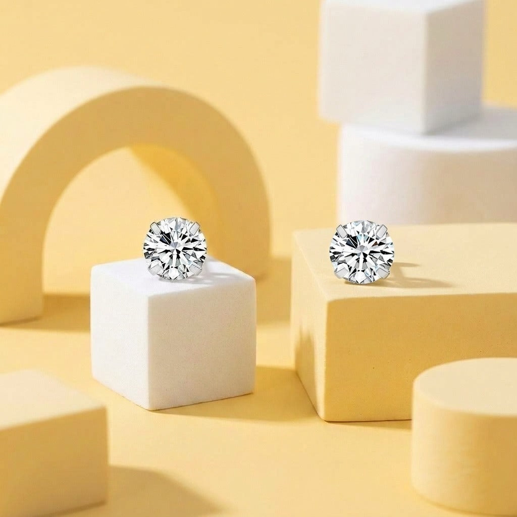 Diamond CZ Flat Back Studs Silver styled on pastel blocks, front and side view