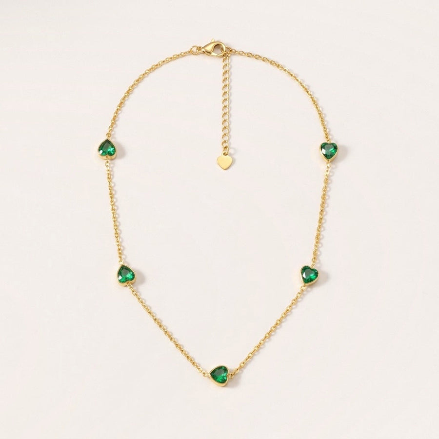 Emerald Heart Dainty Necklace: hypoallergenic necklace, shown front and side on a soft stone background