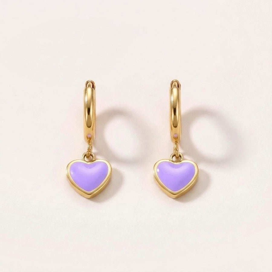 Heart Huggies Gold in Lilac: hypoallergenic kids' huggie hoop earrings, shown front and side on a soft stone background