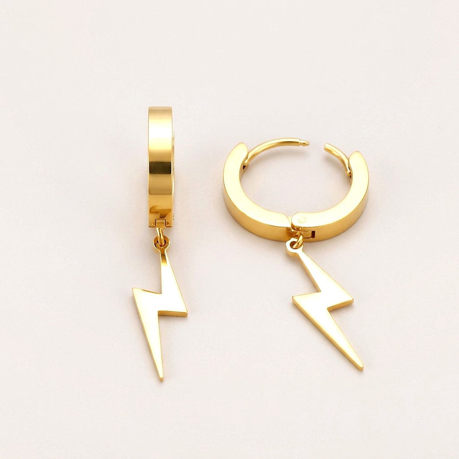 Lighting Bolt Huggies: hypoallergenic huggie hoop earrings, shown front and side on a soft stone background