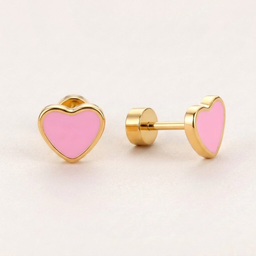 Love Heart Flat Back Studs Gold in Pink: hypoallergenic kids' flat back stud earrings, shown front and side on a soft stone background