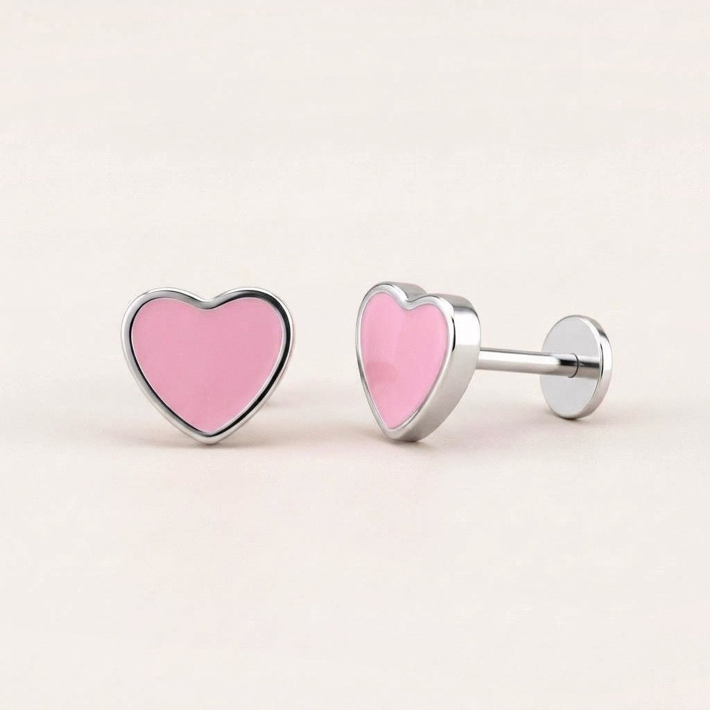 Love Heart Flat Back Studs Silver in Pink: hypoallergenic kids' flat back stud earrings, shown front and side on a soft stone background