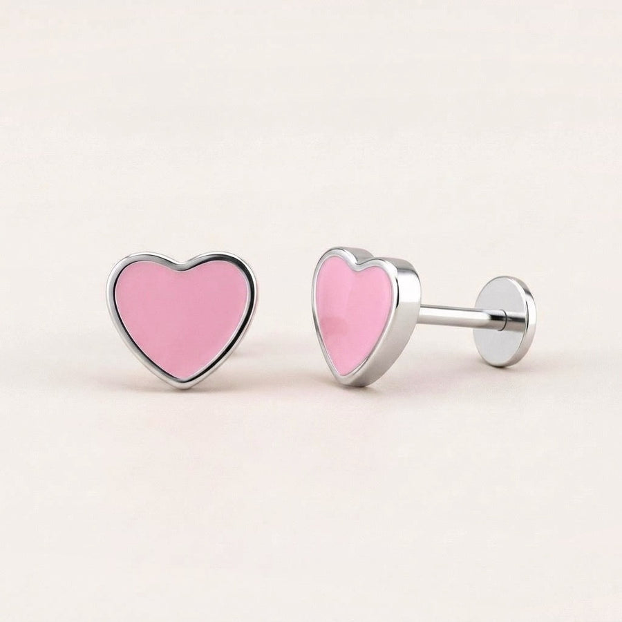 Love Heart Flat Back Studs Silver in Pink: hypoallergenic kids' flat back stud earrings, shown front and side on a soft stone background