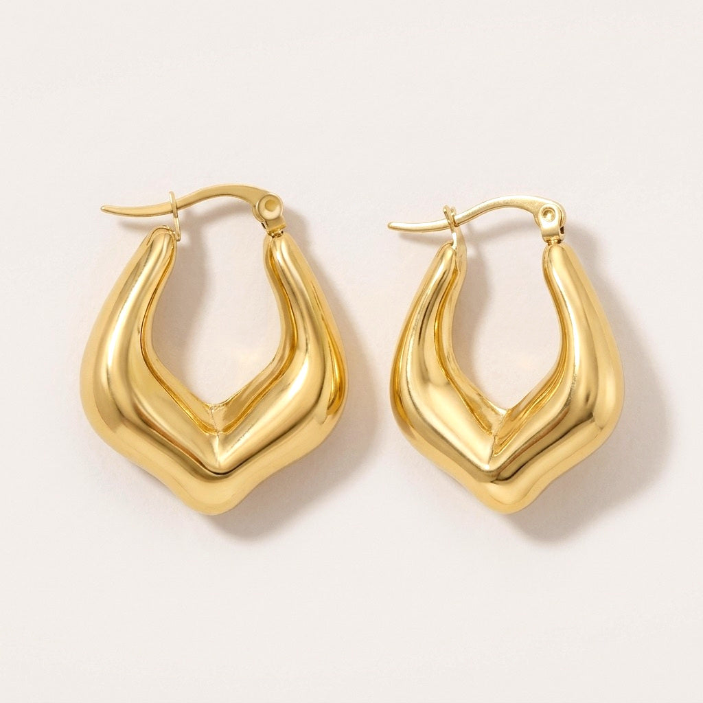 Luxe Drop Hoops: hypoallergenic hoop earrings, shown front and side on a soft stone background