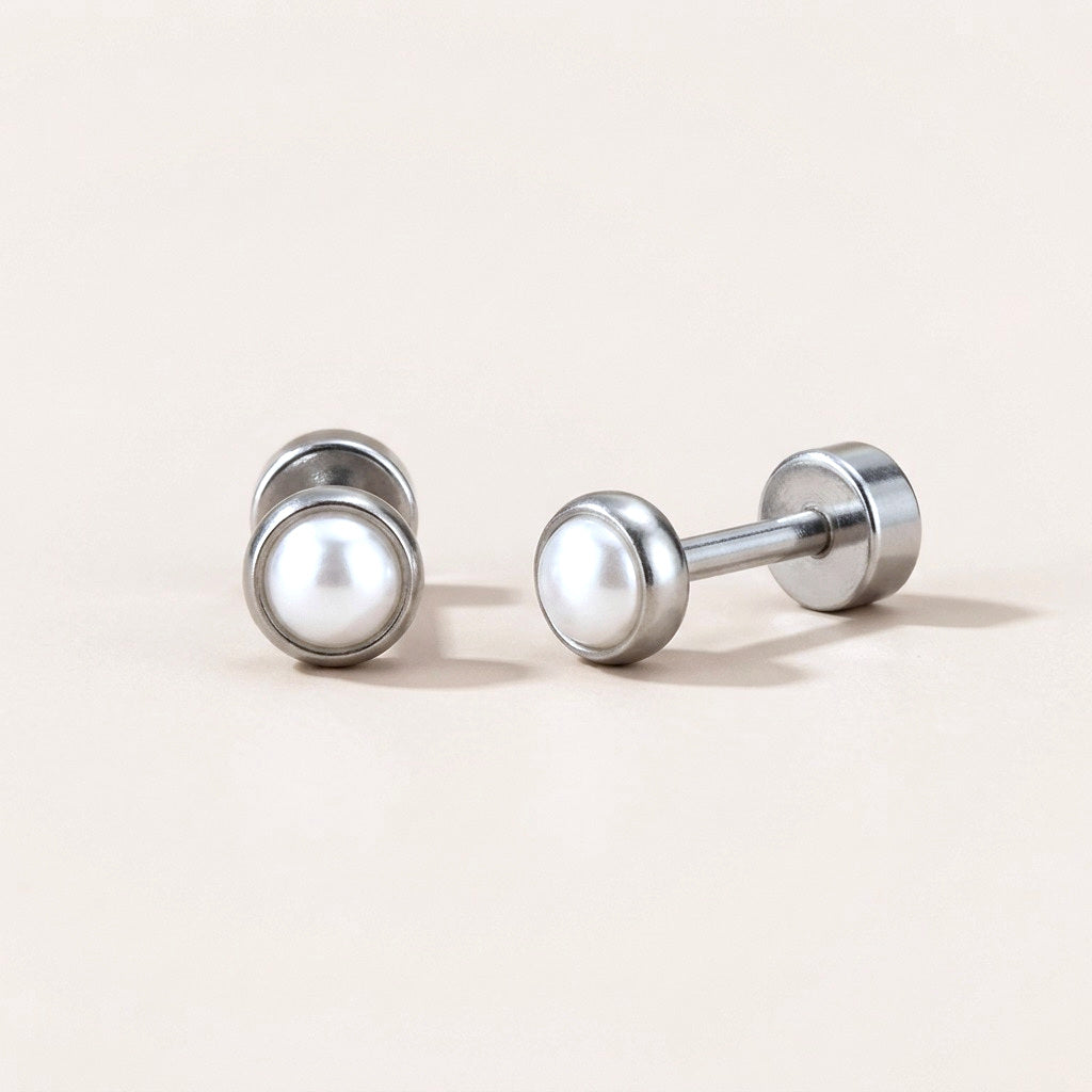 Pearl Bezel Flat Back Studs Silver: hypoallergenic kids' flat back stud earrings, shown front and side on a soft stone background