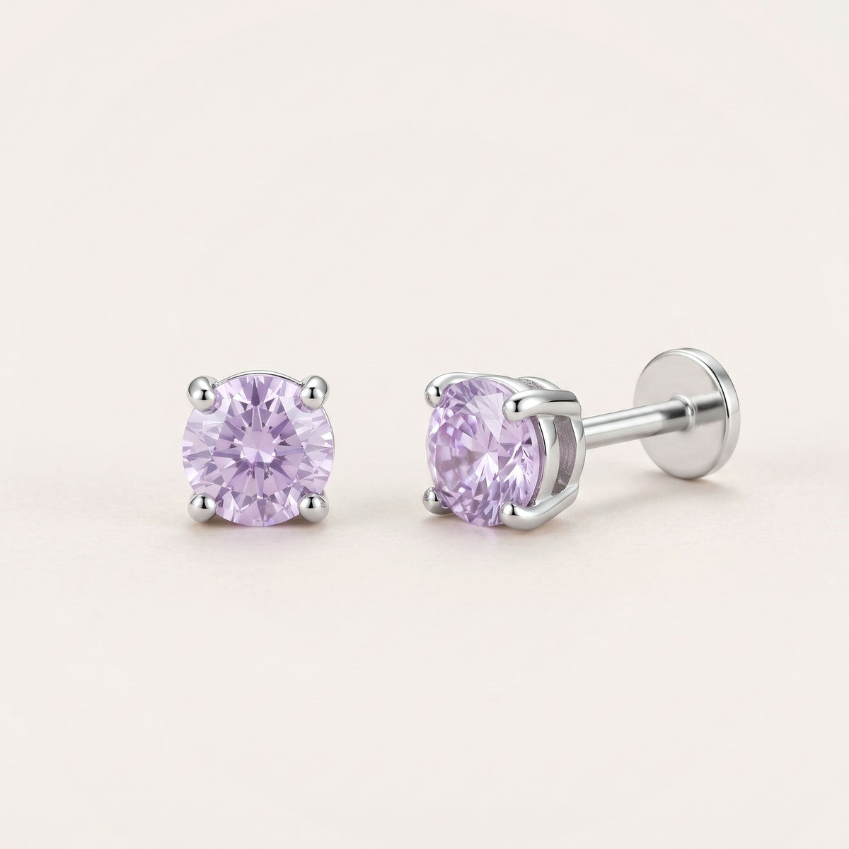 The Birthstone Flat Back Studs Silver in Alexandrite: hypoallergenic kids' flat back stud earrings, shown front and side on a soft stone background