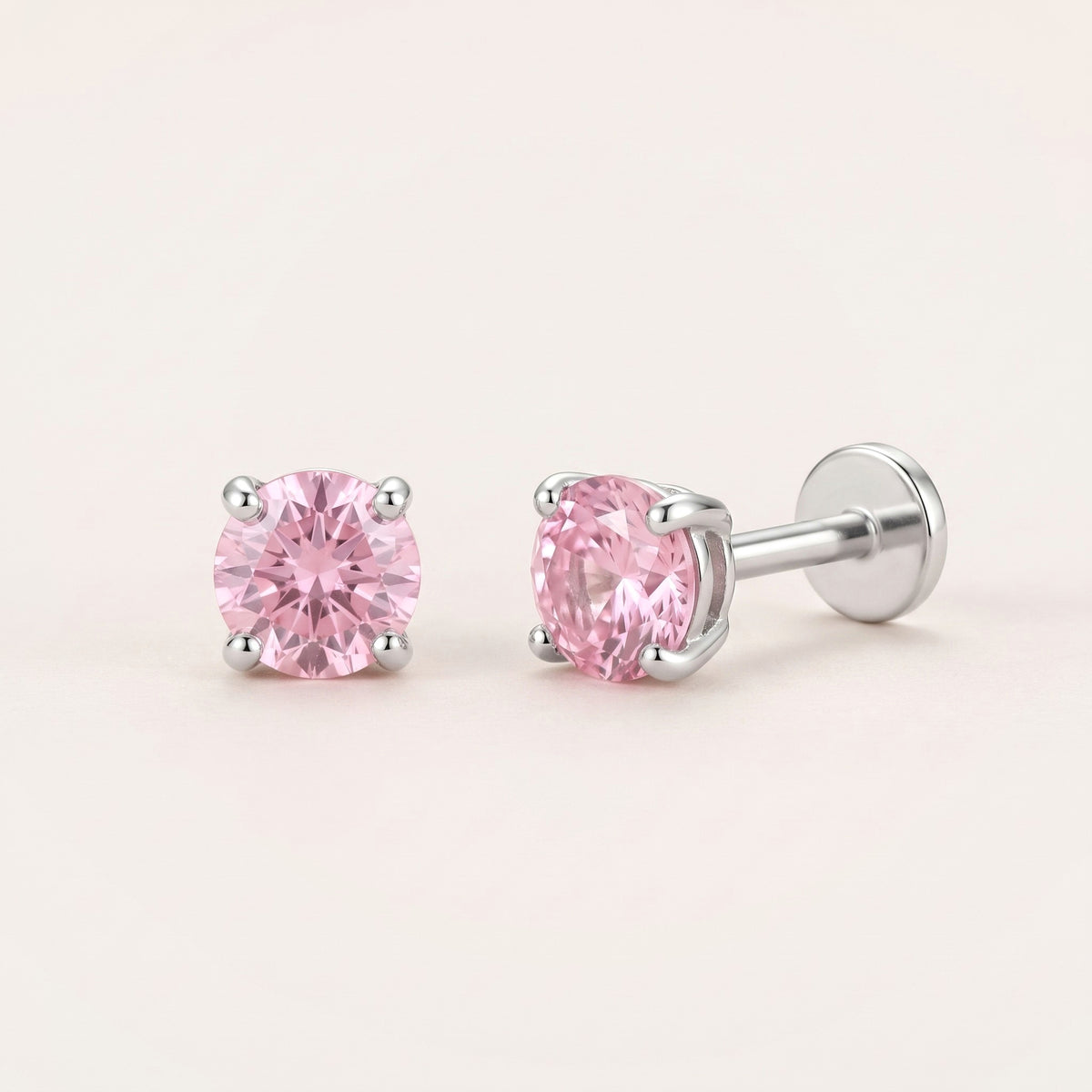 The Birthstone Flat Back Studs Silver in Pink Tourmaline: hypoallergenic kids' flat back stud earrings, shown front and side on a soft stone background