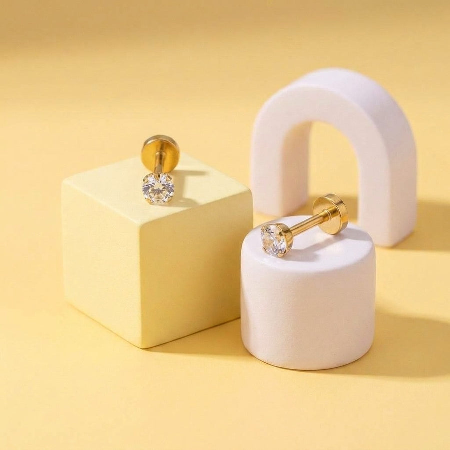 Birthstone Flat Back Studs Gold styled on pastel blocks, front and side view
