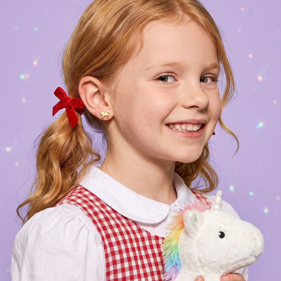 Unicorn Flat Back Studs worn by a smiling girl, animal lover look: hypoallergenic kids' earrings