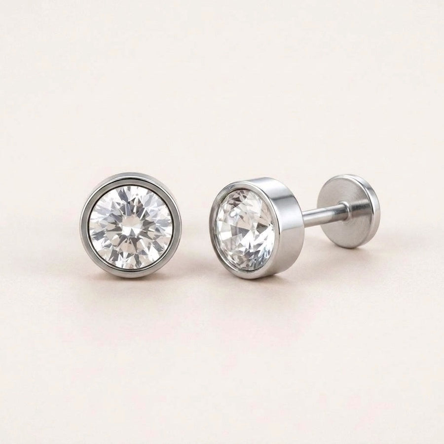 Diamond Bezel Flat Back Studs Silver: hypoallergenic kids' flat back stud earrings, shown front and side on a soft stone background