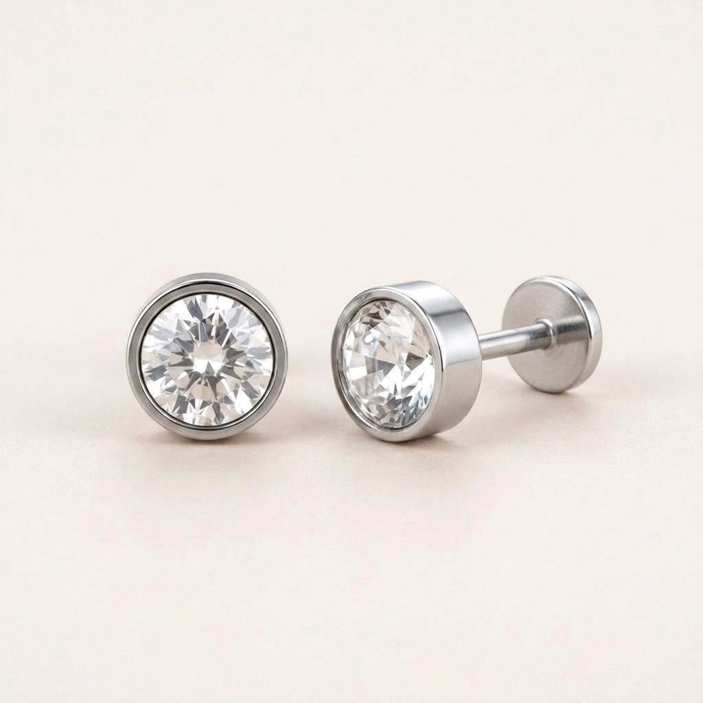 Diamond Bezel Flat Back Studs Silver: hypoallergenic kids' flat back stud earrings, shown front and side on a soft stone background