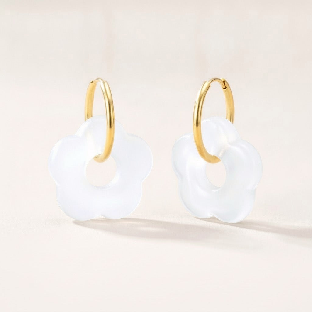 Frosted Bloom Hoops White: hypoallergenic kids' hoop earrings, shown front and side on a soft stone background
