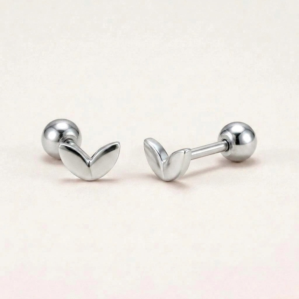 Mini Leaf Screw Back Studs Silver: hypoallergenic kids' screw back stud earrings, shown front and side on a soft stone background