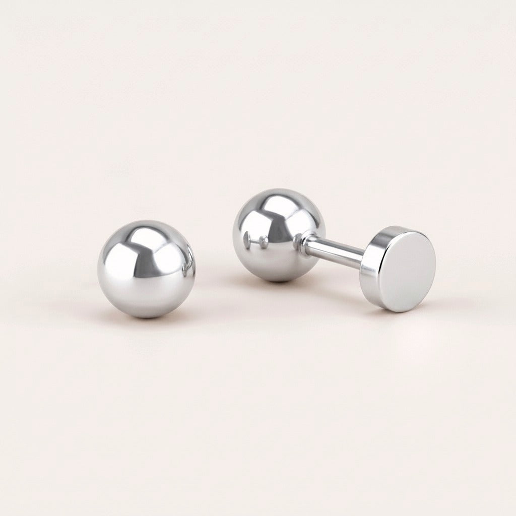 Simple Flat Back Studs Silver: hypoallergenic kids' flat back stud earrings, shown front and side on a soft stone background