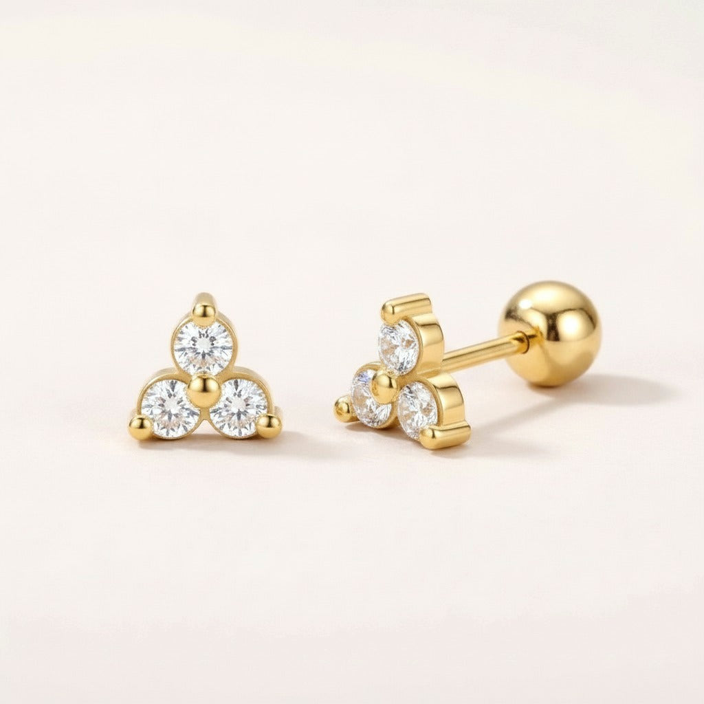Twinkle Trio Screw Back Studs: hypoallergenic kids' screw back stud earrings, shown front and side on a soft stone background