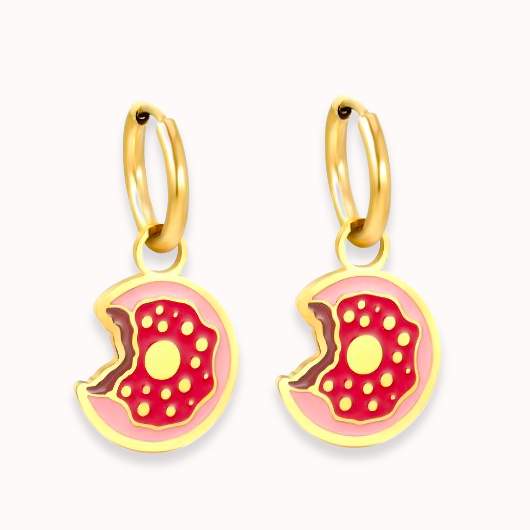 Gold hoop earrings with pink donut-shaped charms on a white background