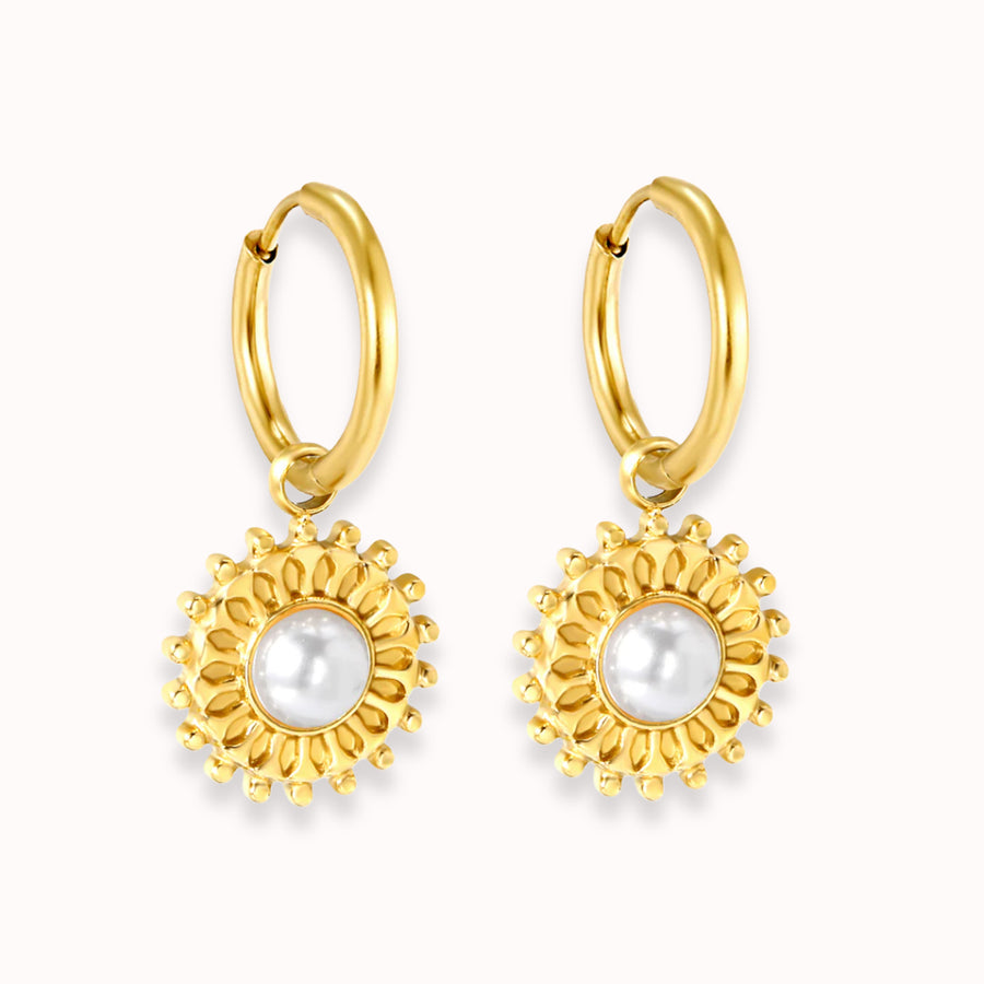 Golden Bloom Huggies: gold huggie hoops with a flower charm and pearl centre