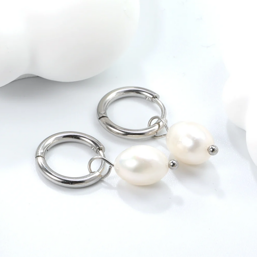 Luna Pearl Drop Huggies in silver: huggie hoops with a pearl drop