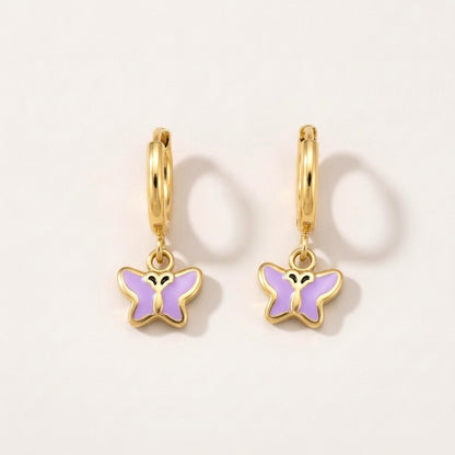 Butterfly Flutter Huggies Gold: hypoallergenic kids' huggie hoop earrings, shown front and side on a soft stone background