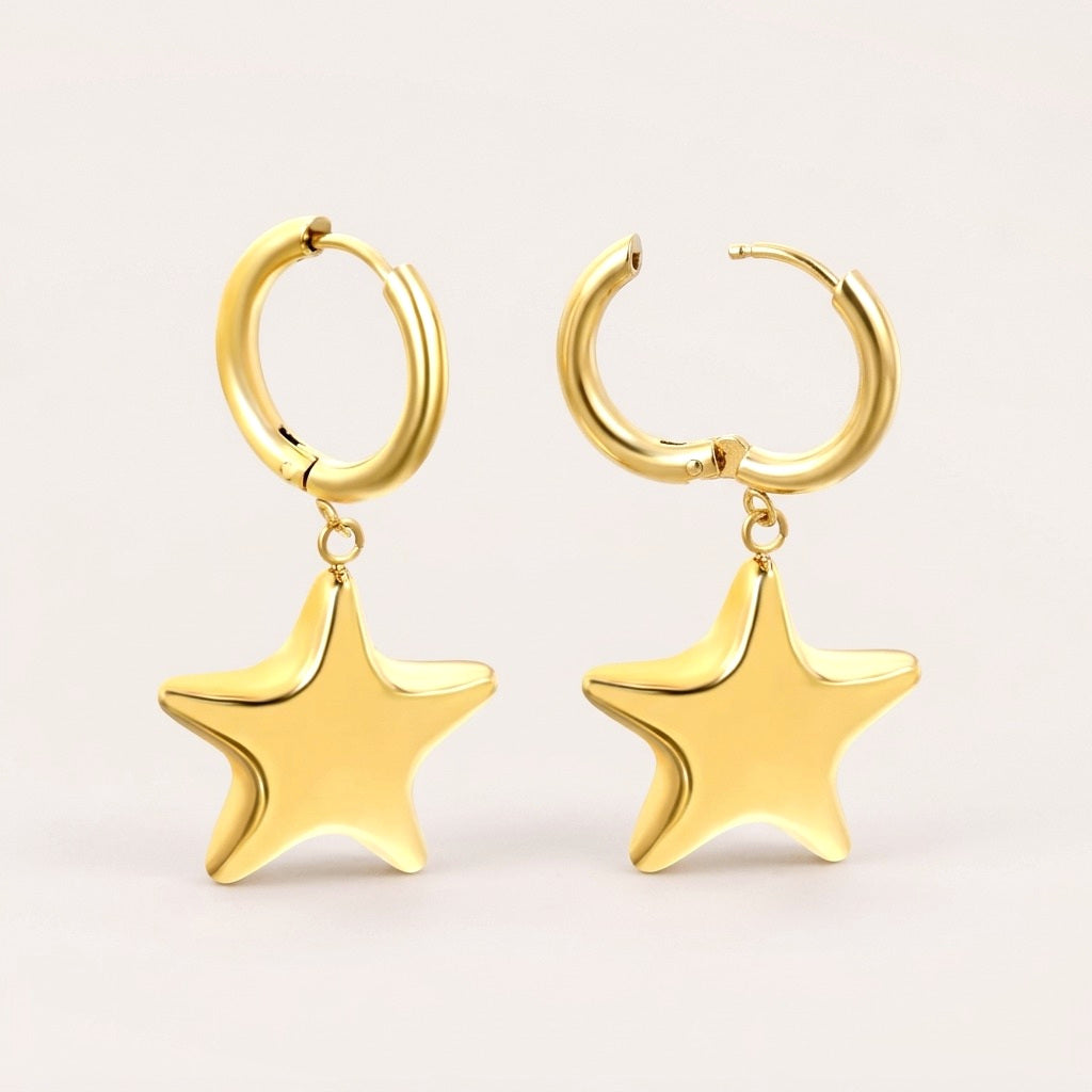 Big Stars Huggies: hypoallergenic huggie hoop earrings, shown front and side on a soft stone background