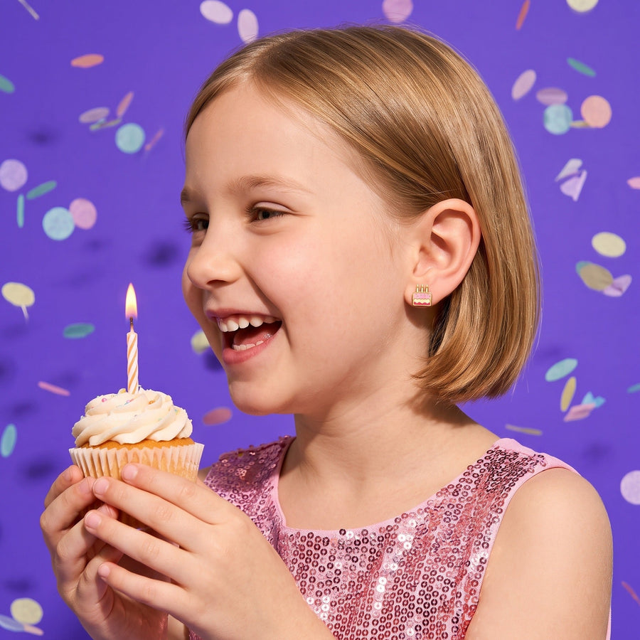Birthday Cake Flat Back Studs worn by a smiling girl, birthday look: hypoallergenic kids' earrings