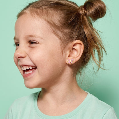 Candy Bow Flat Back Studs worn by a smiling girl