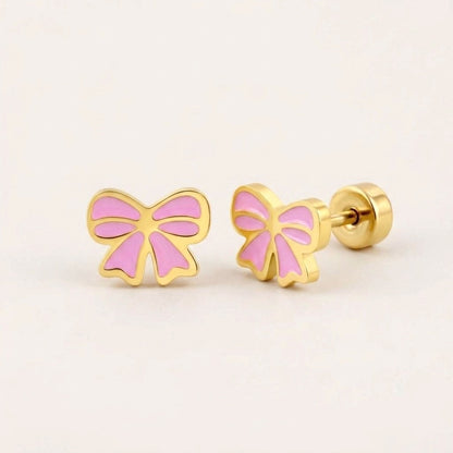 Candy Bow Flat Back Studs on a soft stone background
