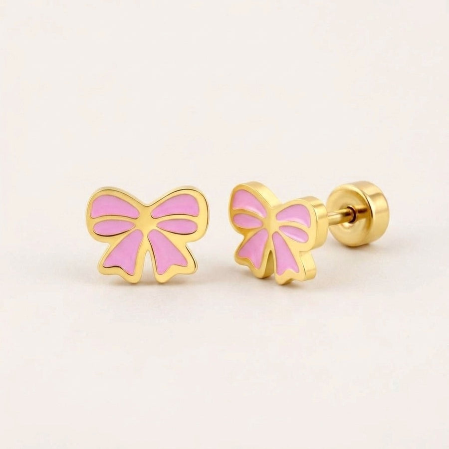 Candy Bow Flat Back Studs on a soft stone background