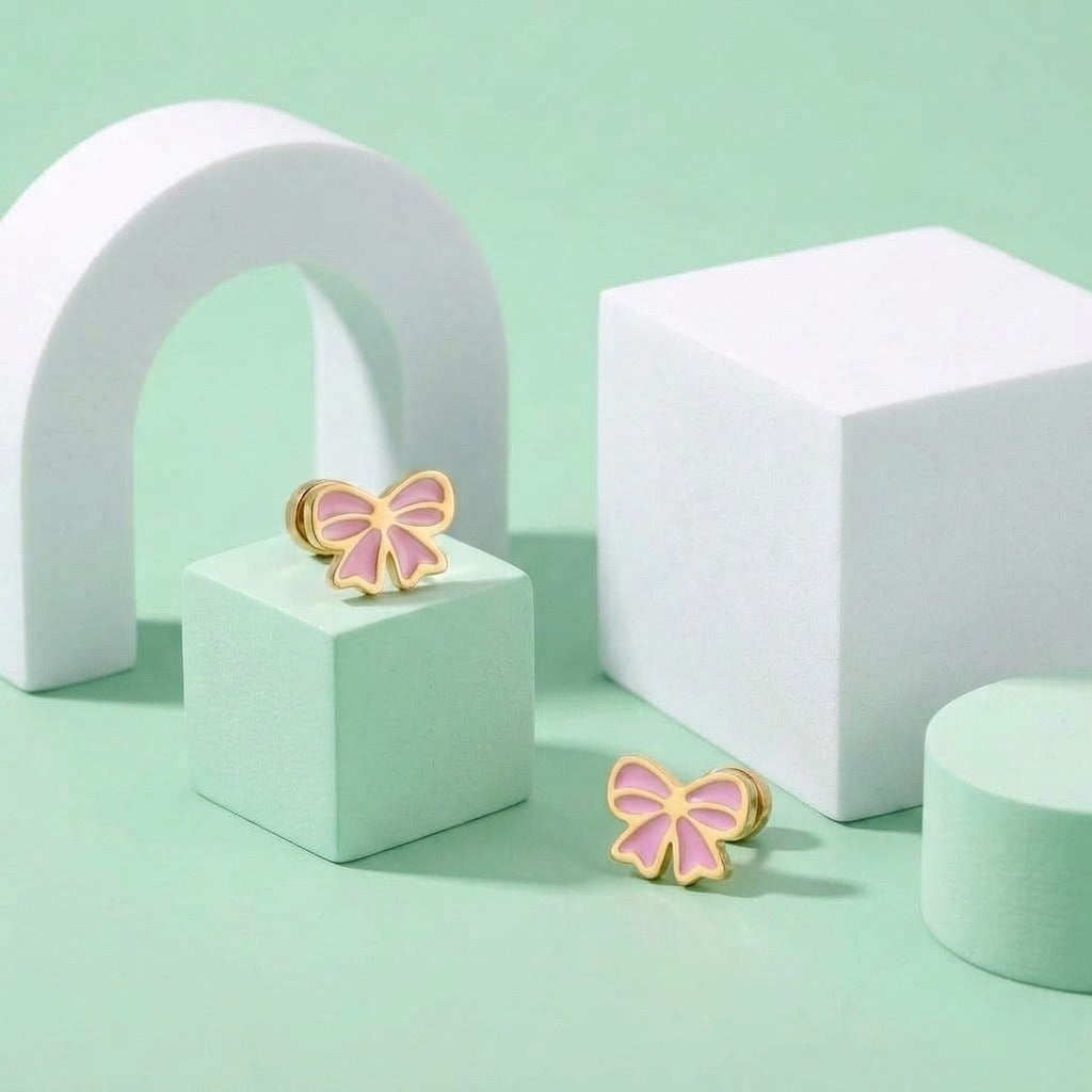 Candy Bow Flat Back Studs styled on pastel blocks, front and side view