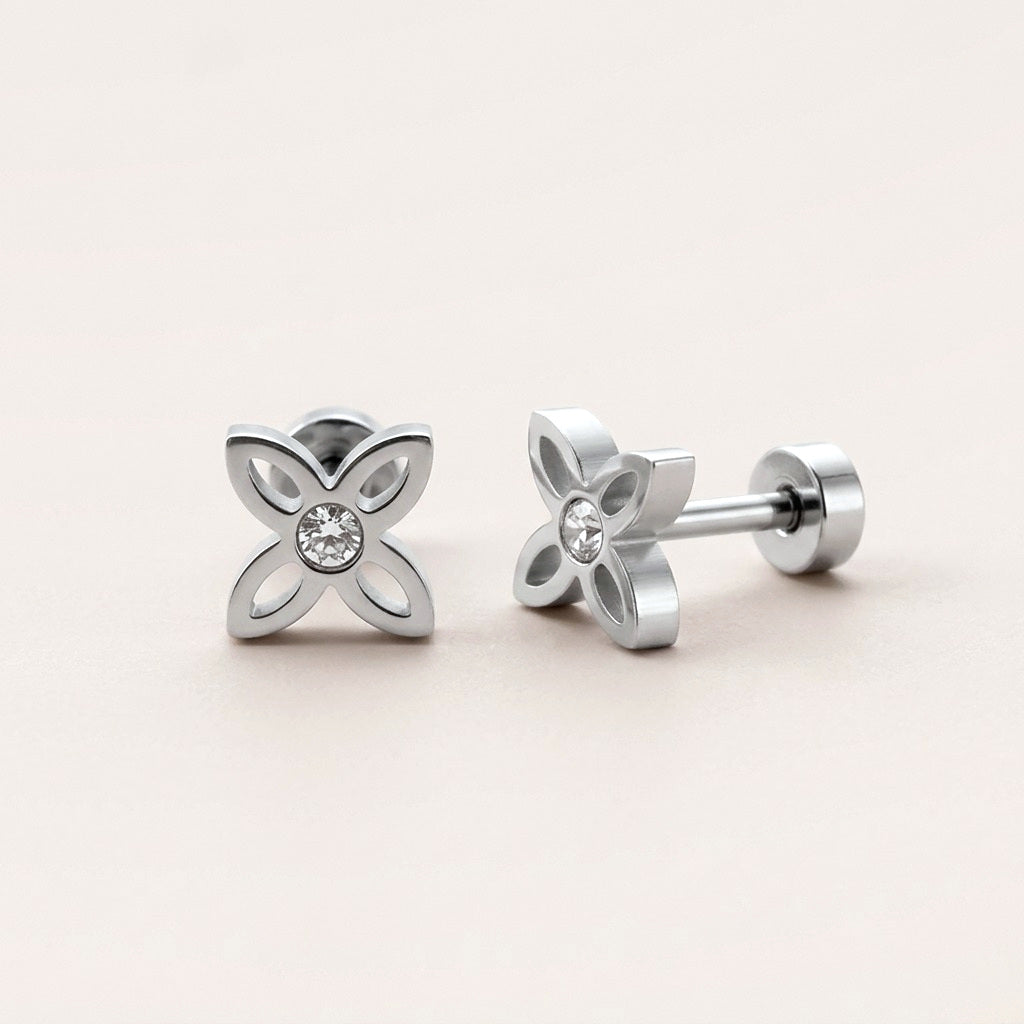 Crystal Flower Stud Screw Back Studs Silver: hypoallergenic kids' screw back stud earrings, shown front and side on a soft stone background