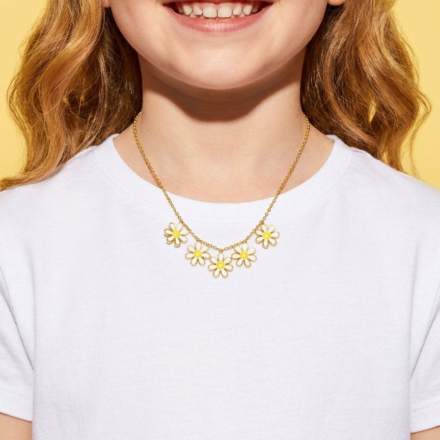 Daisy Chain Necklace worn by a smiling girl in a white t-shirt