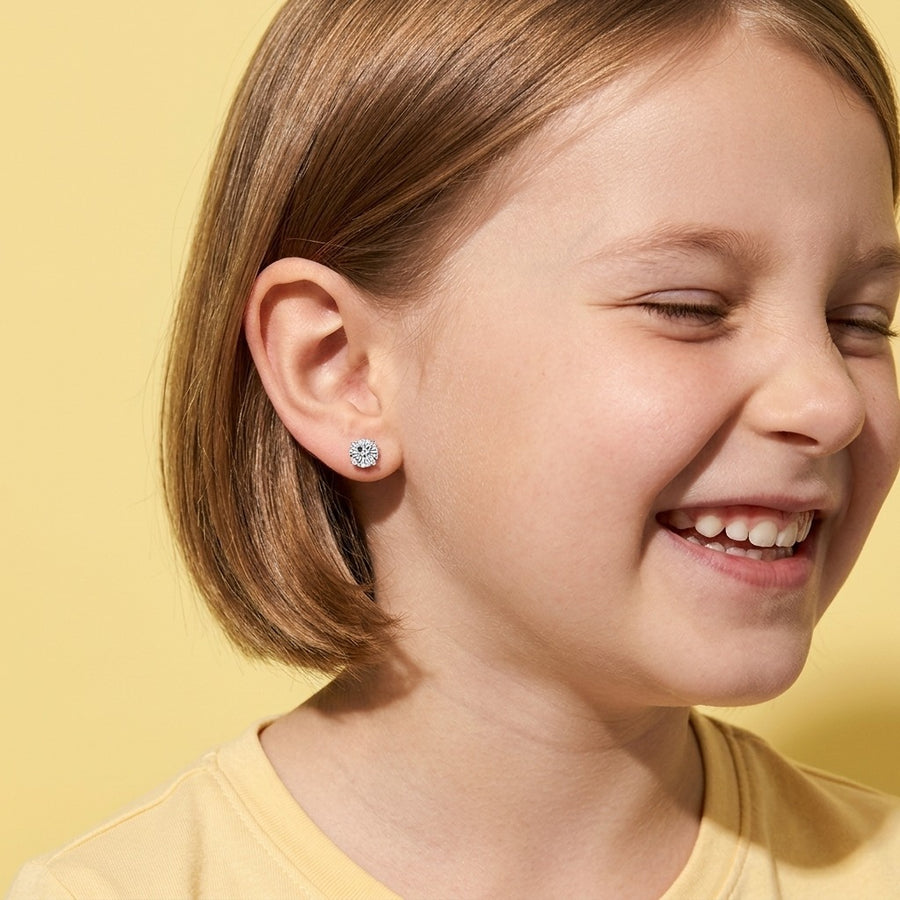 Diamond CZ Flat Back Studs Silver worn by a smiling girl