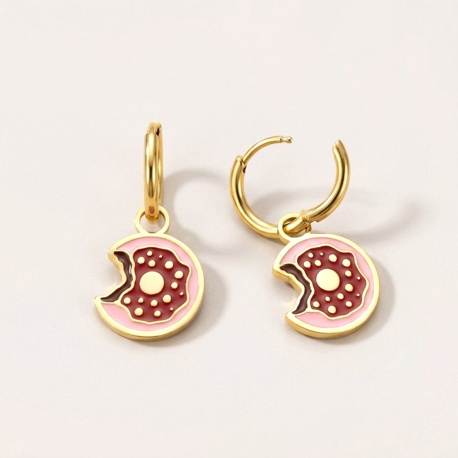 Donut Huggies: hypoallergenic kids' huggie hoop earrings, shown front and side on a soft stone background
