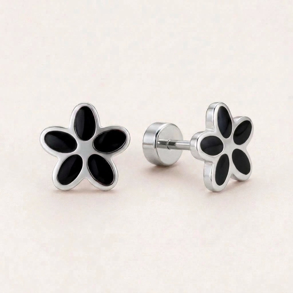 Flower Flat Back Studs Silver in Black: hypoallergenic kids' flat back stud earrings, shown front and side on a soft stone background