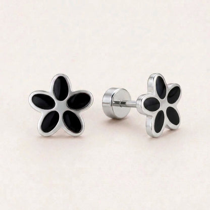 Flower Flat Back Studs Silver in Black: hypoallergenic kids' flat back stud earrings, shown front and side on a soft stone background