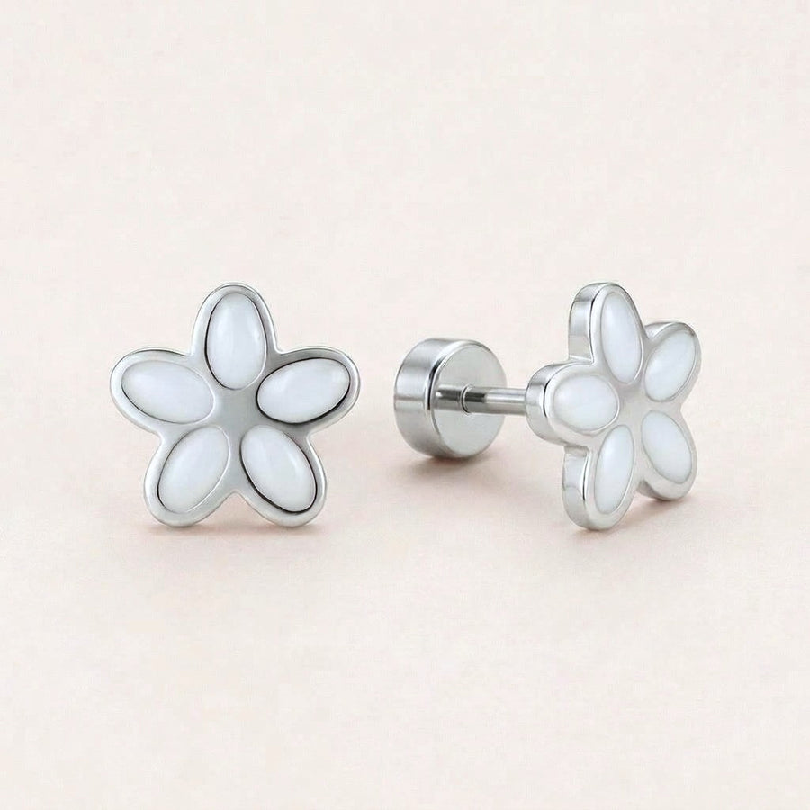 Flower Flat Back Studs Silver in White: hypoallergenic kids' flat back stud earrings, shown front and side on a soft stone background