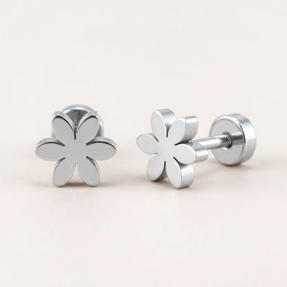 Flower Flat Back Studs Silver: hypoallergenic kids' flat back stud earrings, shown front and side on a soft stone background