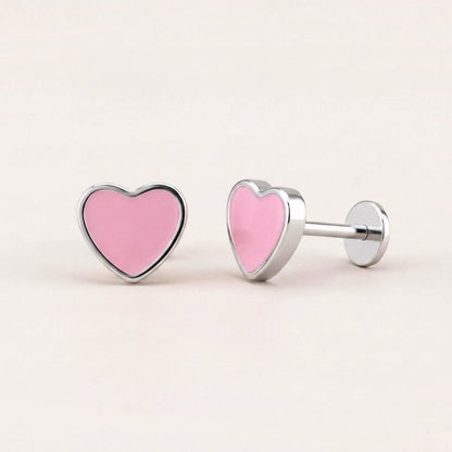 Love Heart Flat Back Studs Silver in Pink: hypoallergenic kids' flat back stud earrings, shown front and side on a soft stone background