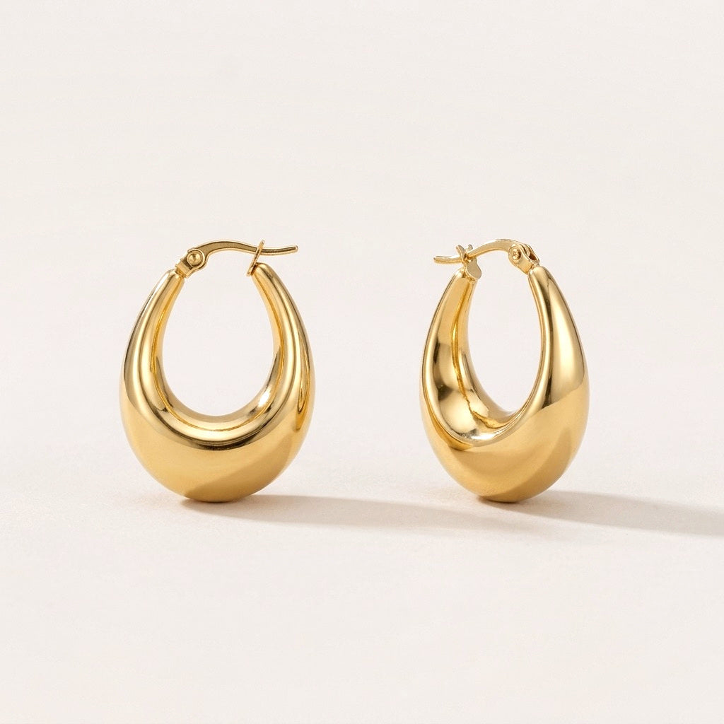 Luna Drop Hoops: hypoallergenic hoop earrings, shown front and side on a soft stone background